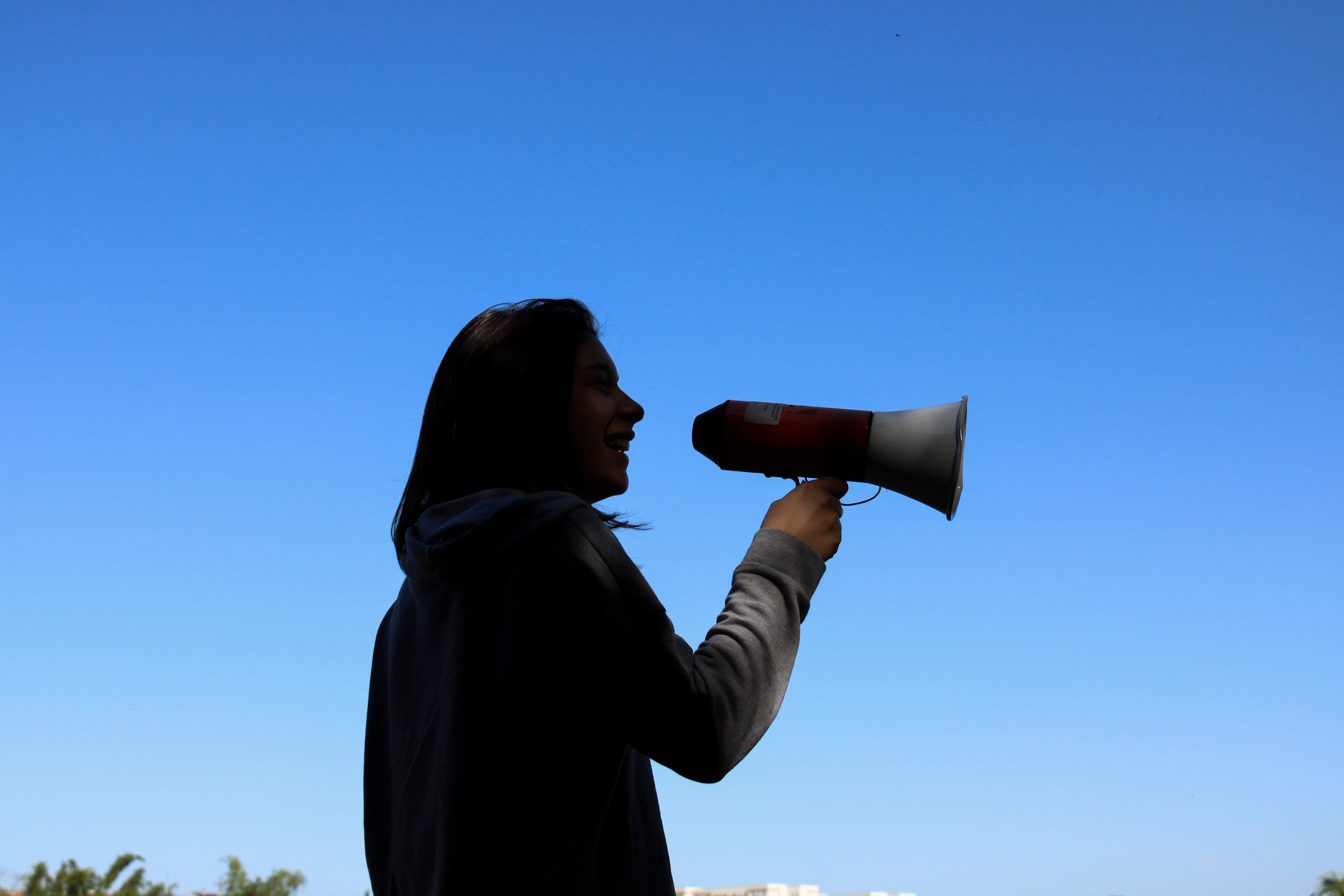 woman holding a megaphone